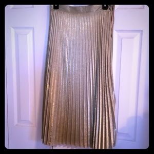 Pleated, metallic gold skirt